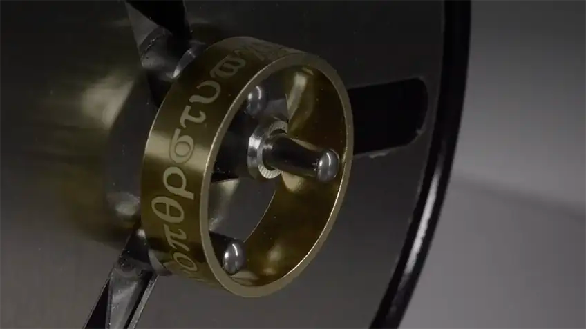 Fibre-laser engraving machine marking text outside a titanium ring in the GETi Birmingham workshop